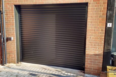 Alluguard 77 Black Rollershutter garage door with Black UPVC reveal liners