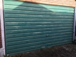 Before - old green garage door