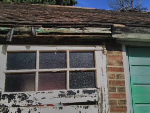 Steel side hinged garage doors manufactured by Cardale - Before