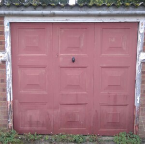 Before - an old brown garage door