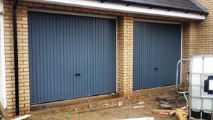 Grey up and over steel ‘Thornby’ design garage doors by Novoferm