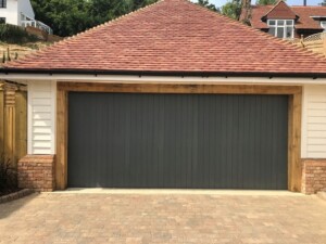 Black Verwood garage door on detached garage